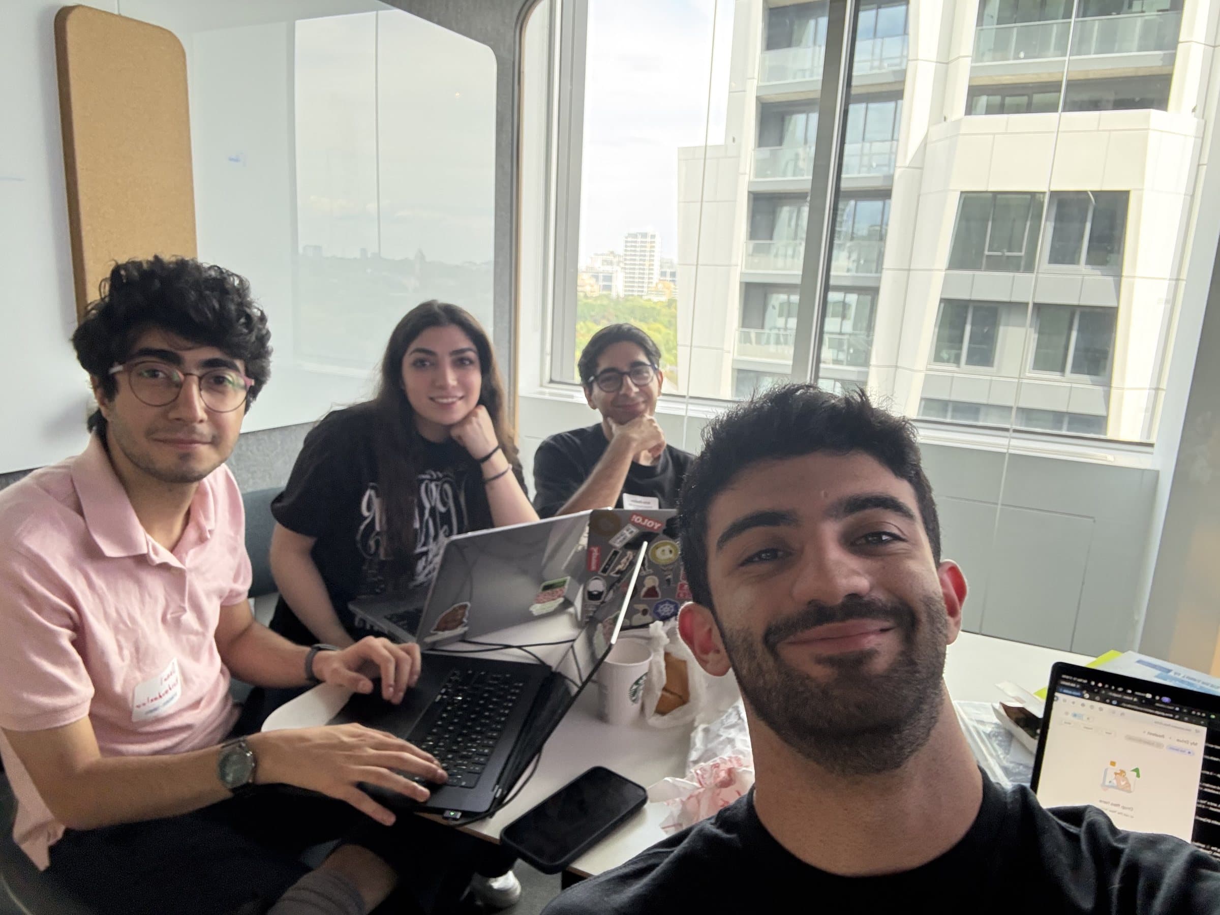 Mahyar taking a selfie with his team at the OpenAI hackathon